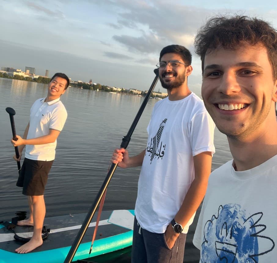 Duc doing standup paddling on the water
